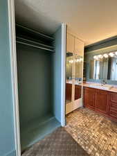 Bathroom featuring vanity and french doors