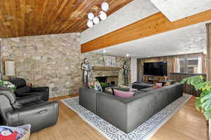 Living area with a fireplace and hardwood / wood-style floors