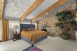 Bedroom featuring multiple windows and carpet flooring