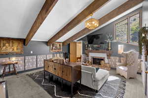 Living room with carpet floors and a fireplace