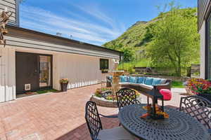 View of patio / terrace featuring a mountain view and outdoor dining area