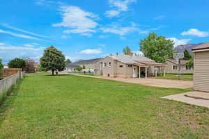 View of yard with concrete driveway