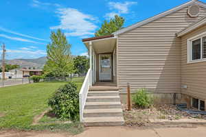 Doorway to property featuring a mountain view