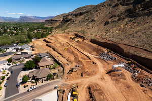 Aerial view of property and surrounding area with mountains