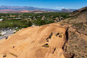 Aerial view of property and surrounding area with mountains