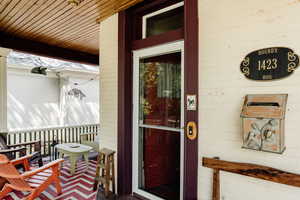 Property entrance with covered porch