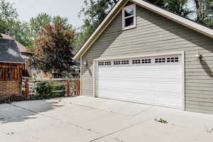 Garage featuring concrete driveway