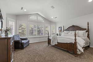 Bedroom with carpet, lofted ceiling, baseboards, and recessed lighting