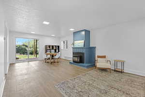 Second Living Space with Gas Fireplace and a Sliding Glass Door to the Backyard