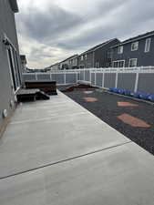 Fenced backyard with a patio area