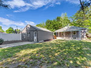 Rear view of house with covered porch