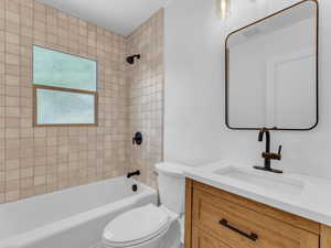 Bathroom with vanity, toilet, and shower / bathtub combination