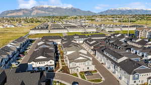 Aerial perspective of suburban area with a mountainous background