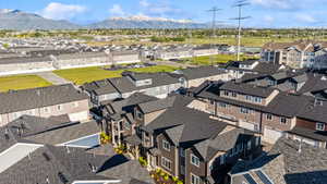 Aerial view of residential area featuring a mountain backdrop