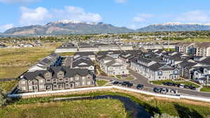 Aerial perspective of suburban area with a mountainous background