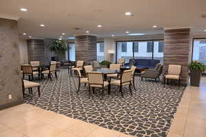 Common area featuring recessed lighting and crown molding