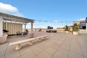 View of patio / terrace featuring outdoor dining area and a pergola