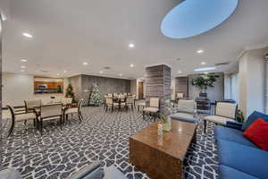 Building lobby with recessed lighting and crown molding