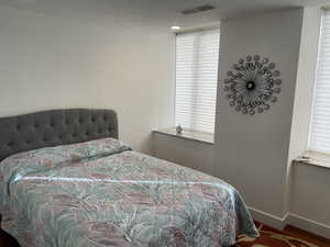 Bedroom featuring baseboards