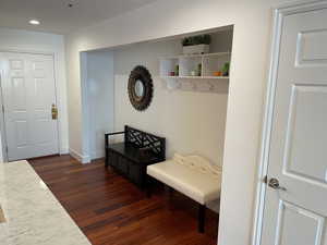Mudroom featuring dark wood-style flooring, recessed lighting, and baseboards