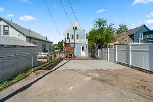 Rear view of house with stairway