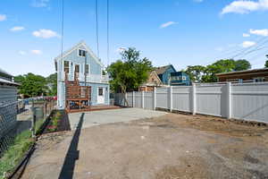 Rear view of house with stairs