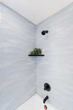 Full bath featuring bathing tub / shower combination