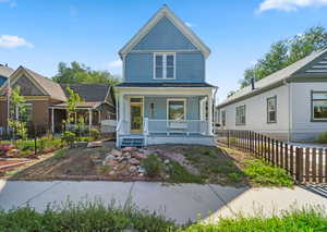 Victorian house featuring a porch