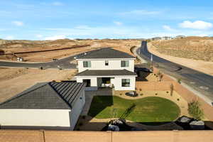 Aerial view of property and surrounding area featuring mountains
