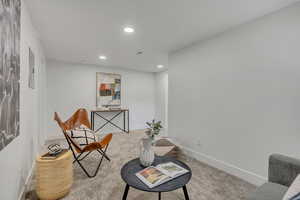 Sitting room with recessed lighting, baseboards, and carpet floors