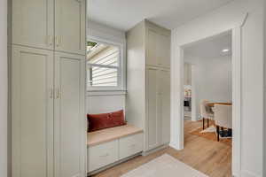 Mudroom featuring light wood-type flooring