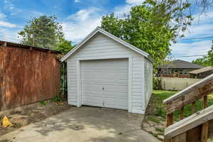 Detached garage with concrete driveway