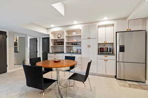Dining space featuring recessed lighting