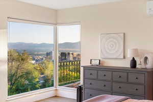 Bedroom featuring a mountain view and a wall mounted AC