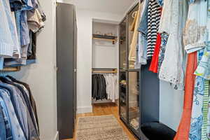 Spacious closet featuring light wood-type flooring