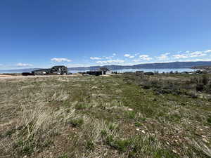 View of yard with a water view