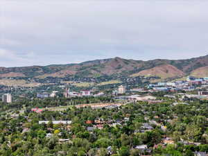 Aerial view of property and surrounding area featuring mountains