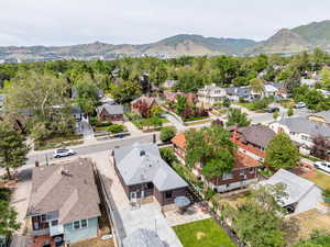 Aerial view of residential area featuring a mountainous background