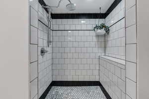 Full bathroom featuring tiled shower