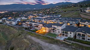 Aerial view of residential area featuring a mountainous background