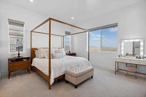 Carpeted bedroom with baseboards and recessed lighting