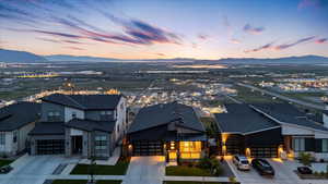 Aerial view of residential area featuring a mountainous background