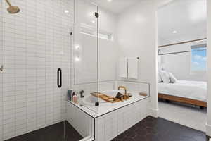 Ensuite bathroom featuring tile patterned floors, a stall shower, a garden tub, and recessed lighting