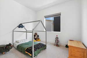 Bedroom with carpet and baseboards