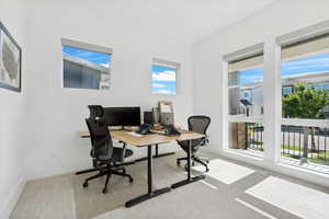 Office area with healthy amount of natural light and baseboards