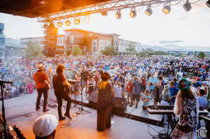 View of home's community free summer concerts for Daybreak residents featuring a mountain view
