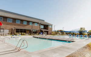 Community pool featuring a patio