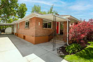 View of front of property featuring a carport