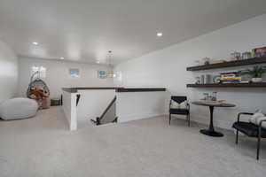 Bar area with carpet, recessed lighting, and baseboards