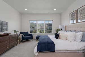 Bedroom featuring light carpet and recessed lighting